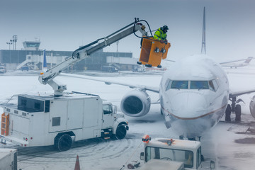 Air plane in winter weather at an airport