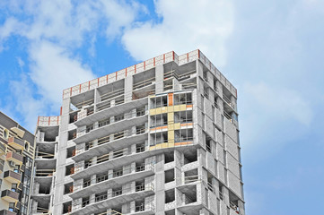 Fototapeta premium Building construction site work against blue sky