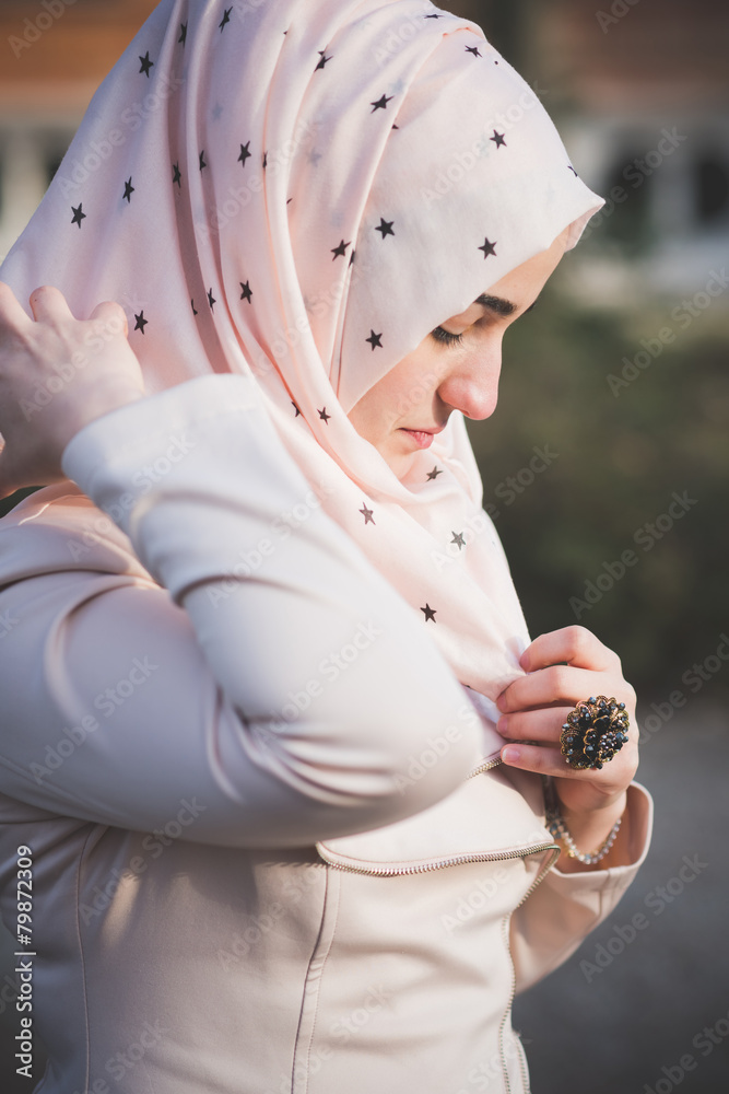 Sticker young beautiful muslim woman at the park