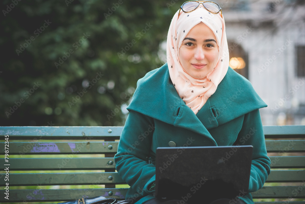 Poster young beautiful muslim woman at the park