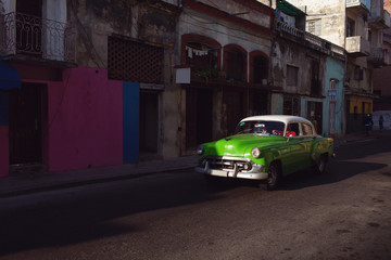 Fototapeta na wymiar HAVANA - FEBRUARY 17: Classic car and antique buildings on Febru