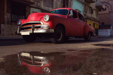 HAVANA - FEBRUARY 17: Classic car and antique buildings on Febru