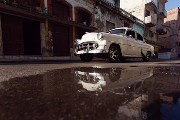 HAVANA - FEBRUARY 17: Classic car and antique buildings on Febru