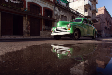 HAVANA - FEBRUARY 17: Classic car and antique buildings on Febru