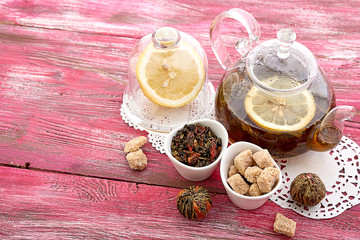 drink in glass teapot on wooden background