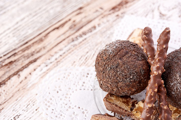 Cupcake with chocolate on wooden background
