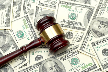 gavel on dollar background
