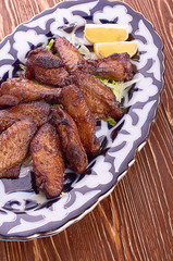 Meat on a grill with vegetables