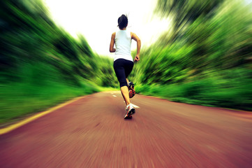 fitness woman runner running on trail 