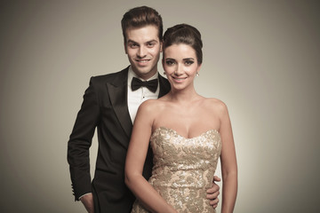 Fototapeta na wymiar Portrait of a happy young elegant couple posing