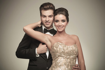 Happy couple smiling at the camera.