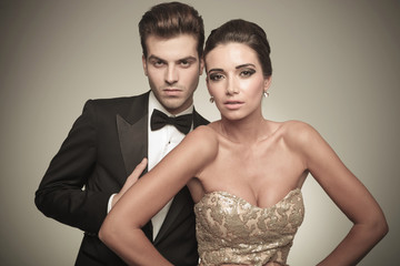 elegant couple posing on studio background