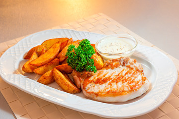 Grill pork and potato wedges with sauce