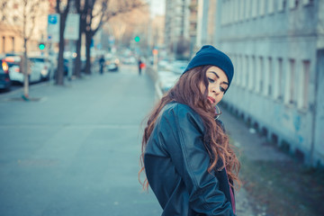 Beautiful girl posing in an urban context