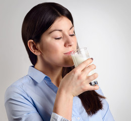 young woman drinking milk