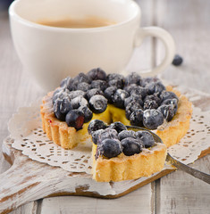 Blueberry tart and a cup of coffee