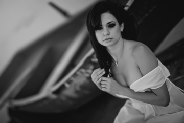 Fototapeta premium beautiful woman in a boat black and white