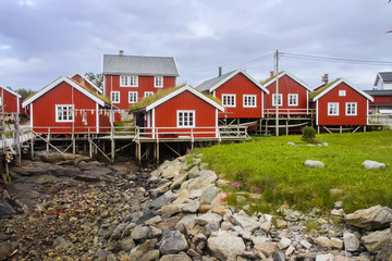Fototapeta na wymiar typical red wooden houses on the coast of Finland