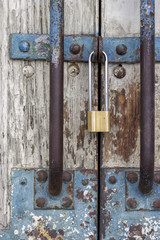 Old wooden door with locked padlock 2