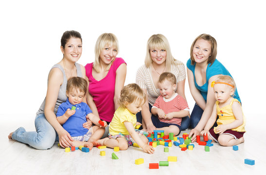Children Group with Mothers Playing Toy Blocks. Little Kids