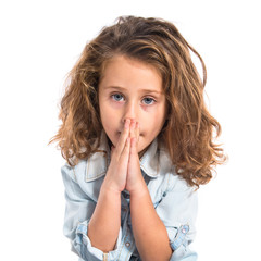 Blonde little girl pleading over white background