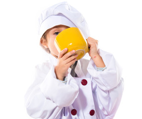 Girl dressed like chef  holding a cup of coffee