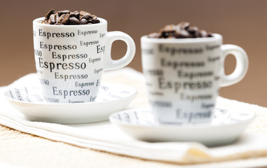 coffee cups full of coffee beans