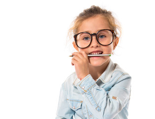 Little girl with glasses studing