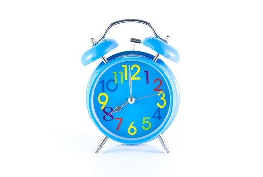 Alarm Clock isolated on white, in blue, showing eight o'clock.