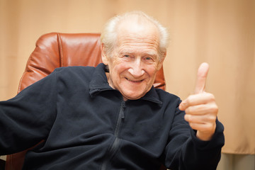 laughing old man with thumbs up