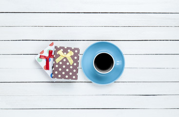 Cup of coffee and gift