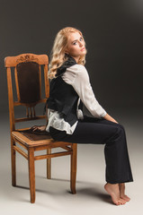 Beauty blond woman on chair