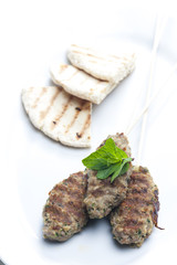 mutton kebab with mint and pita bread