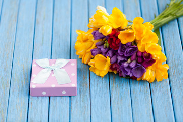 Gift box and bouquet of flowers