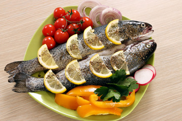 trout with vegetables on plate