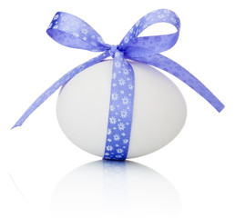Easter egg with festive purple bow isolated on white background