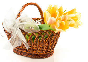 Fototapeta na wymiar Tulips in basket with bow
