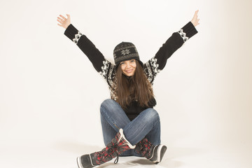 Happy young woman wearing warm winter clothing smiling