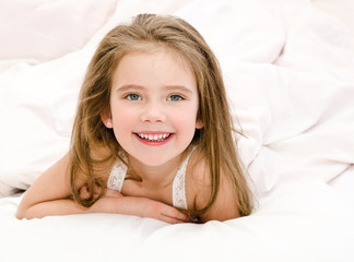 Adorable smiling little girl waked up