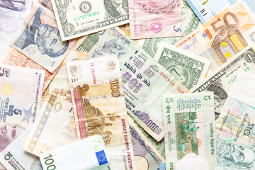 many different currencies as background