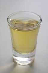 Isolated glass of alcohol