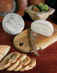 selection of italian cheese sliced on wood background