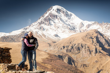 Girl tourist on a background of mountains