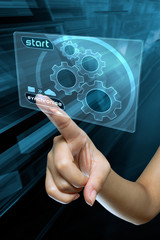 a woman finger synchronise  data on a digital screen