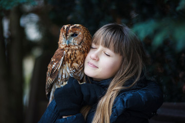 Cute girl with little owl