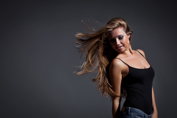 Naklejka premium Happy woman are jumping, grey background