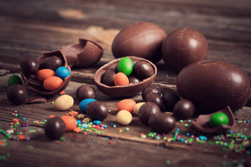 Chocolate Easter Eggs Over Wooden Background