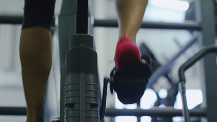 Feet cycling on an exercise bike