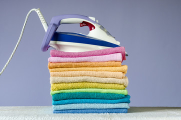 Ironing colorful towels