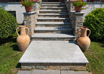 natural stone stairs in a beautiful home garden